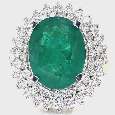 18k B/Tne 6.65ct Oval Emerald & 1.24ct Diamonds Cluster Ring
